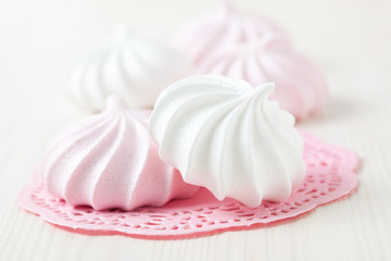 Meringues on pink mat