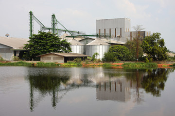 industrial, silo near pond.