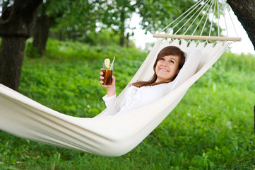 Young woman resting on hammock