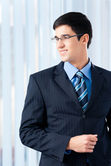 Portrait of smiling businessman at office