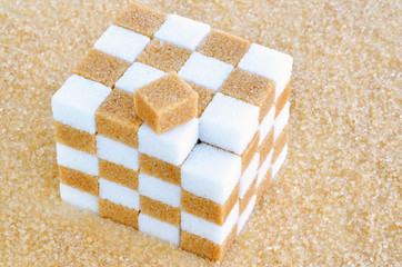 Cube of brown and white sugar cubes