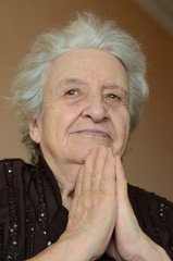 senior woman praying