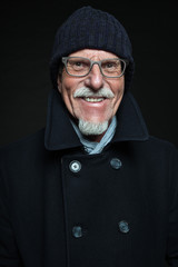 Good looking senior man winter fashion. Studio shot.