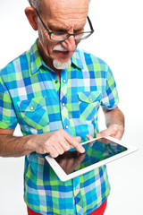 Well dressed senior man with tablet computer. Isolated.