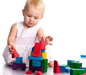 Beautiful baby building a castle