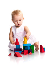 Beautiful baby building a castle