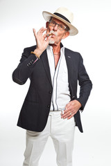 Gangster mafia man smoking cigar. Isolated on white.