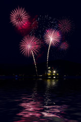 Fireworks with lake reflection