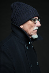 Good looking senior man winter fashion. Studio shot.