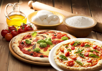 pizza with ingredients on wooden table