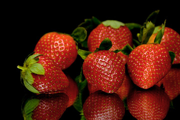 strawberries on a black background closeup