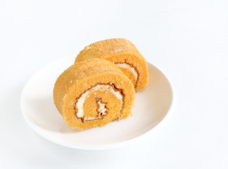 roll cake with cream on white