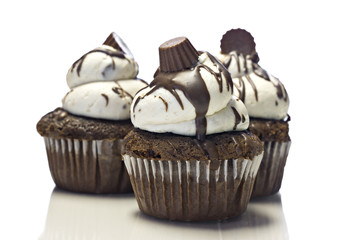 Three cupcakes on white background