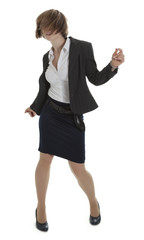 Young woman in business dress dancing