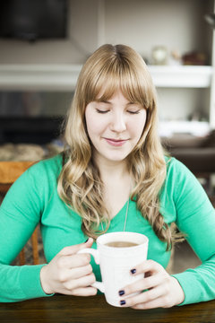Young Woman Drinking Coffee