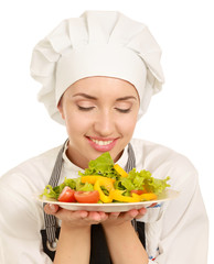 Pretty cook chief holding salad