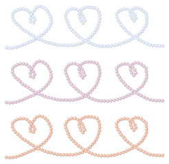 Pink, blue and lavender strings of pearls in a heart shape in ve