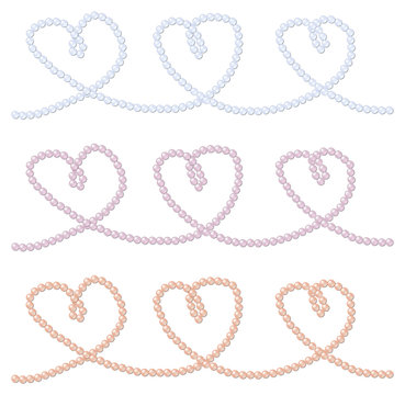 Pink, blue and lavender strings of pearls in a heart shape in ve