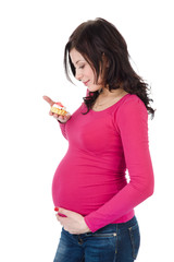 pregnant woman eating  cookie. isolated on white