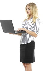 Fototapeta premium young blonde business woman standing using laptop