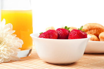 Breakfast with berries,orange juice and croissant