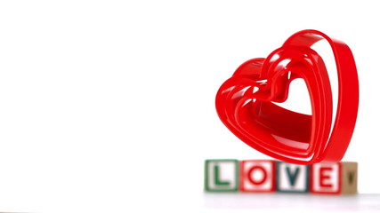 Heart ornaments falling in slow motion - Powered by Adobe