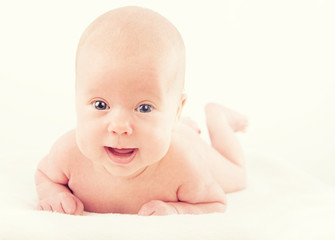 happy naked newborn baby on white background