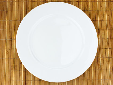 white plate on a bamboo napkin