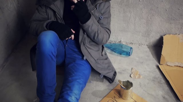 homeless sitting on the floor