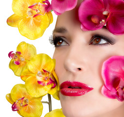Beautiful Girl With Orchid Flowers. Makeup.