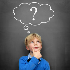 Child at the Blackboard with question Mark - obrazy, fototapety, plakaty