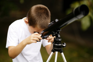 little boy with telescope