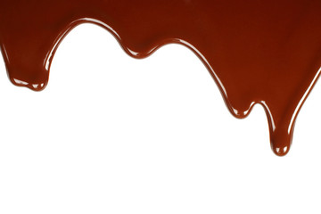 Melted chocolate dripping on white background .