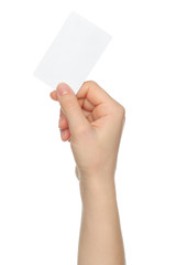 Hand holds charge card on white background.