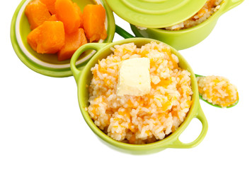 Taste rice porridge with pumpkin in saucepans, isolated