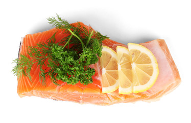 Fresh salmon fillet with herbals and lemon slices, isolated