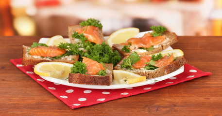 Salmon sandwich on plate,on bright background