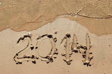 sand number 2014 on beach with wave
