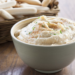 Chickpea hummus bowl with bread sticks