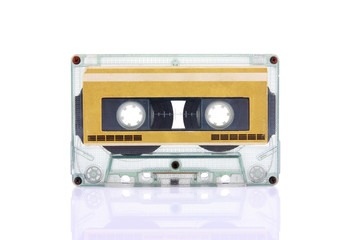 Compact Cassette isolated on white with blank gold color label