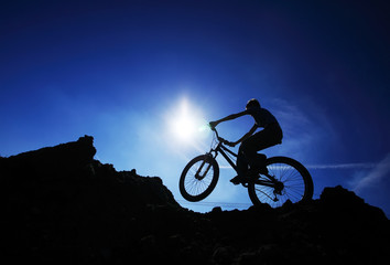 Cyclist silhouette on BMX bike