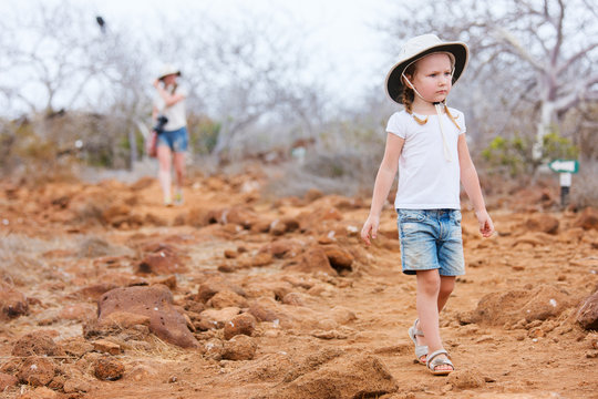 Little girl hiking at scenic terrain