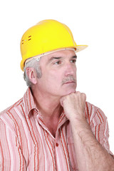 Tradesman deep in thought