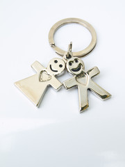 A  miniature groom and bride keychain isolated on white backgrou