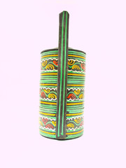 A colorful traditional tiffin carrier from Bagan, Burma isolated