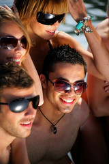 Group of young people on a beach holiday