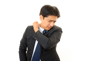 肩こりを訴えるビジネスマン