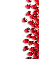 red glass hearts on white background