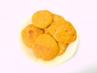 Pile of cookies on a Chiness porcelane plate isolated on white b