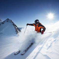 Skier in high mountains